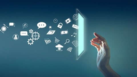 A hand reaching toward a glowing screen as app and service icons stream out of it.