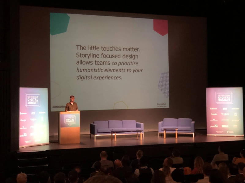 Photograph of our team presenting at an industry event.